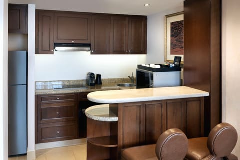 Suite, 1 King Bed, Non Smoking | Private kitchen | Mini-fridge, coffee/tea maker, electric kettle, highchair