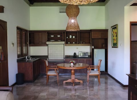 One bedroom Villa with private pool (Jepun) | Private kitchen | Full-size fridge, microwave, dishwasher, coffee/tea maker