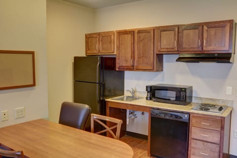 Suite, 1 Bedroom | Private kitchen | Full-size fridge, microwave, stovetop, dishwasher