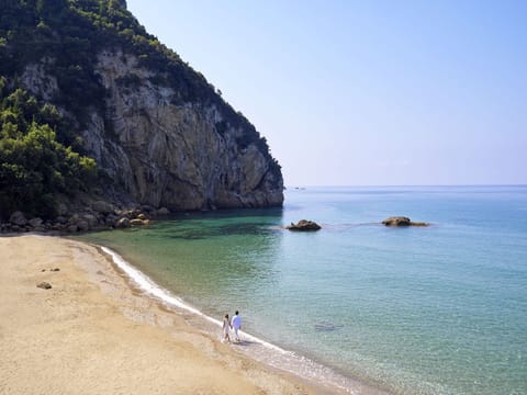 On the beach, sun loungers, beach umbrellas, beach towels