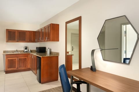 Suite, 1 Bedroom | Desk, laptop workspace, blackout drapes, iron/ironing board