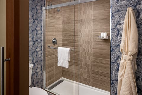 Designer toiletries, hair dryer, bathrobes, slippers