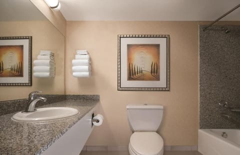 Skyrise Family Tower Double Queen Room | Bathroom | Combined shower/tub, eco-friendly toiletries, hair dryer, towels