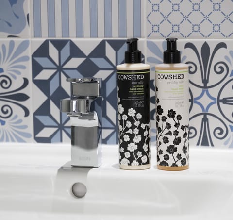 Designer toiletries, hair dryer, towels