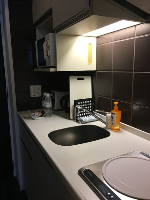 Fridge, microwave, electric kettle, cookware/dishes/utensils