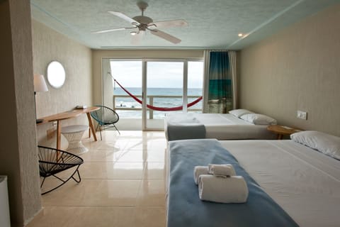 Double Room, Ocean View | Minibar, in-room safe, individually decorated, individually furnished