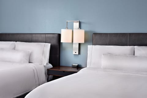 Premium bedding, down comforters, pillowtop beds, in-room safe