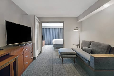 Suite, 1 Bedroom | Desk, laptop workspace, blackout drapes, iron/ironing board