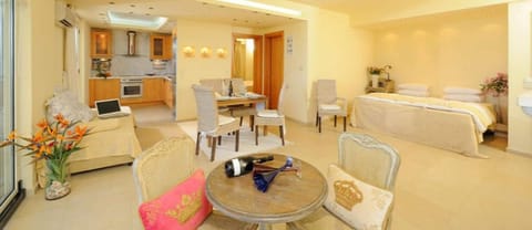 Executive Suite, Sea View | Living area | 20-inch flat-screen TV with satellite channels, TV