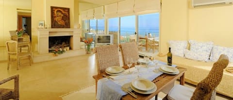 Executive Suite, Sea View | Living room | 20-inch flat-screen TV with satellite channels, TV