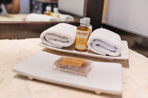 Suite, Poolside | Bathroom amenities | Shower, free toiletries, hair dryer, bathrobes