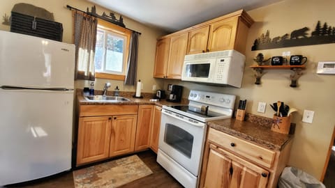 Luxury Cabin, 1 King Bed, Hot Tub, River View | Private kitchen | Microwave, coffee/tea maker, toaster, highchair