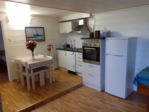 Comfort Apartment B, 1 Bedroom | Private kitchen | Full-size fridge, stovetop, coffee/tea maker, electric kettle