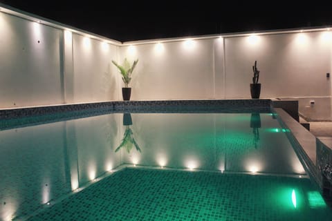 Indoor pool, open 10:00 AM to 11:00 PM, pool umbrellas