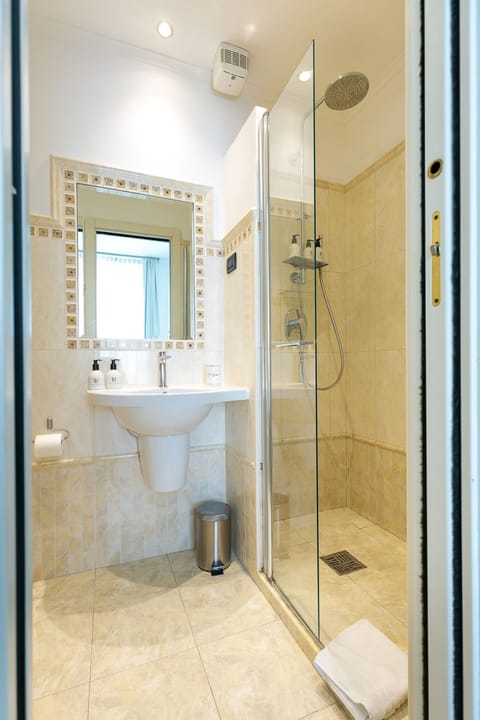 Shower, designer toiletries, hair dryer, bidet