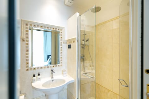 Shower, designer toiletries, hair dryer, bidet