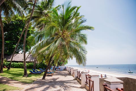 On the beach, white sand, beach towels, beach massages