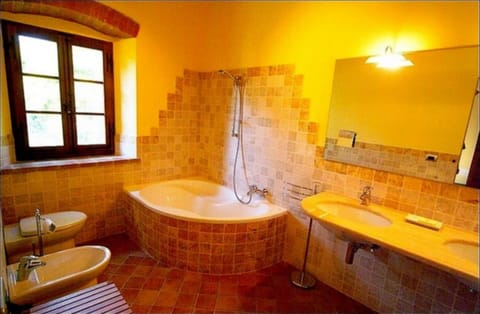 Deep soaking tub, rainfall showerhead, hair dryer, bidet