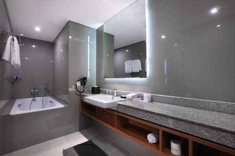 ASTON Suite | Bathroom | Shower, free toiletries, hair dryer, slippers