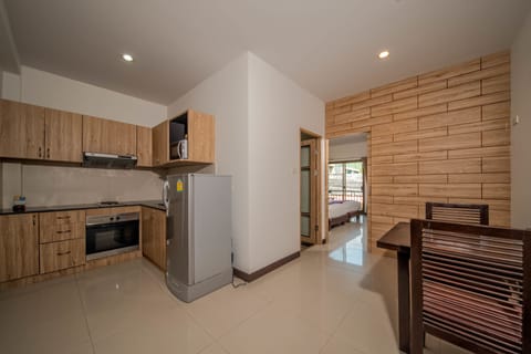 One-Bedroom Apartment | Private kitchen | Fridge, microwave, electric kettle, highchair