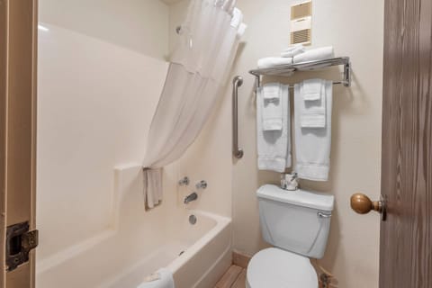 Desk, laptop workspace, blackout drapes, iron/ironing board