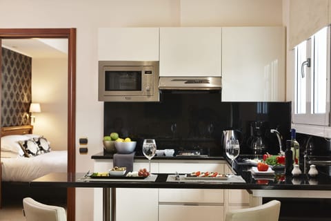 Exclusive Suite, City View | Private kitchenette | Fridge, microwave, stovetop, coffee/tea maker