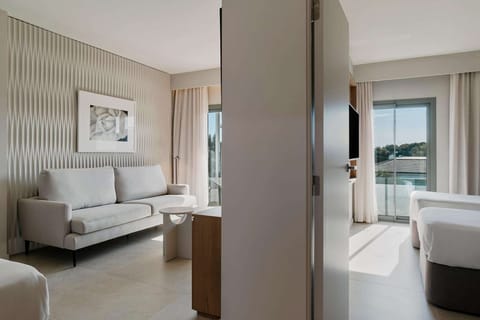 Suite, 2 Bedrooms, Balcony | Minibar, in-room safe, blackout drapes, soundproofing