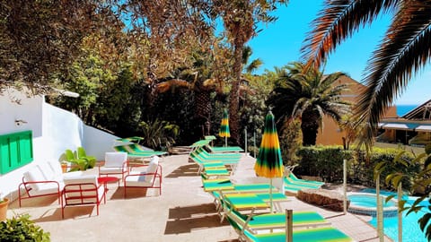 Seasonal outdoor pool, open 9:00 AM to 8:30 PM, pool umbrellas