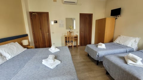 Economy Quadruple Room | Frette Italian sheets, Select Comfort beds, desk, free WiFi