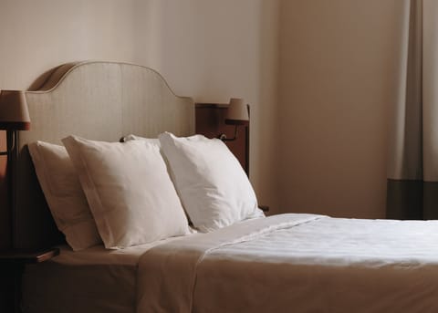 Premium bedding, down comforters, minibar, in-room safe