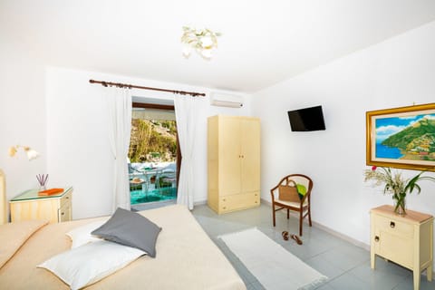 Double Room, Partial Sea View, Annex Building | Minibar, in-room safe, desk, laptop workspace