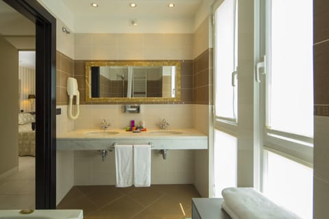 Suite, Terrace, Oceanfront | Bathroom | Shower, rainfall showerhead, eco-friendly toiletries, hair dryer