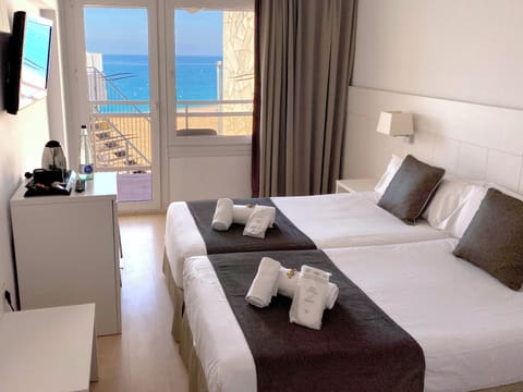 Twin Room, Balcony, Partial Sea View | Down comforters, in-room safe, desk, blackout drapes