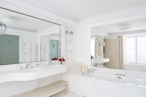 Penthouse Suite | Bathroom | Separate tub and shower, rainfall showerhead, designer toiletries