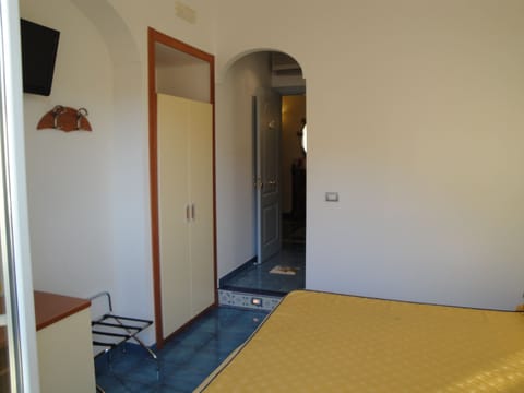 Economy Double Room | Minibar, in-room safe, individually decorated, individually furnished