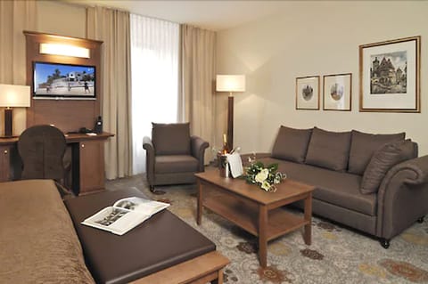 Deluxe Double Room | Living area | Flat-screen TV