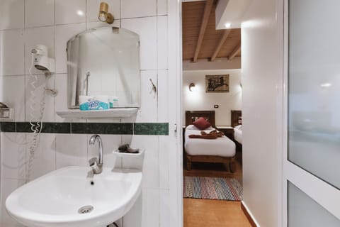 Family Quadruple Room | Bathroom | Separate tub and shower, hair dryer, bathrobes, bidet