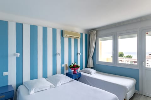 Triple Room, Sea View | Select Comfort beds, in-room safe, free cribs/infant beds, free WiFi