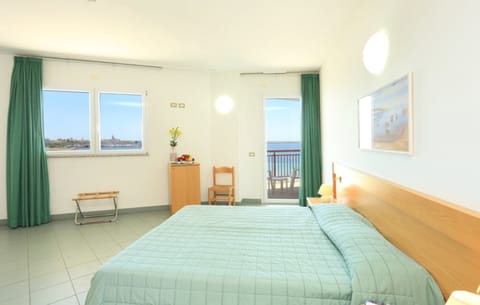 Double Room, Balcony, Sea View | Minibar, in-room safe, desk, free WiFi