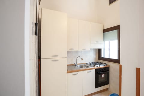 Apartment, 2 Bedrooms (4 pax) | Private kitchen | Fridge, stovetop, coffee/tea maker, electric kettle