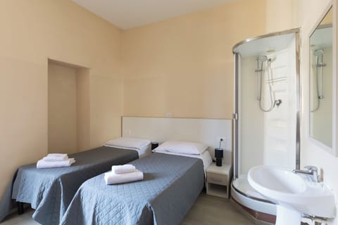 Basic Twin Room, 2 Twin Beds, Shared Bathroom (with sink and shower) | Iron/ironing board, free WiFi, bed sheets