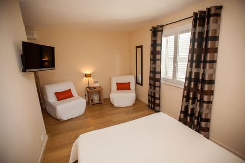 Comfort Quadruple Room | In-room safe, individually decorated, individually furnished, desk