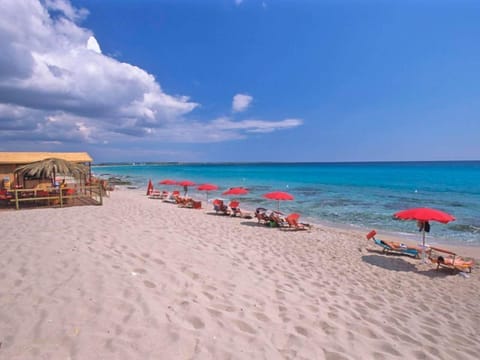 Private beach, white sand, sun loungers, beach umbrellas