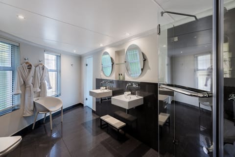 Materolli Suite | Bathroom | Designer toiletries, hair dryer, bathrobes, slippers