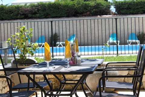 Breakfast, lunch served; French cuisine, pool views 