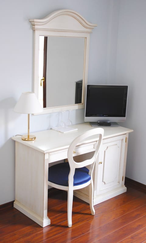 Superior Triple Room | Minibar, in-room safe, desk, blackout drapes