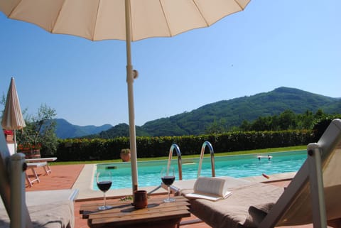 Seasonal outdoor pool, pool umbrellas, sun loungers