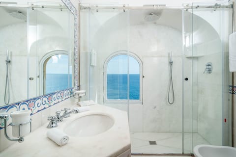 Junior Suite, Balcony, Sea View | Bathroom | Eco-friendly toiletries, hair dryer, bathrobes, slippers