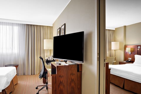 Family Suite, 1 King Bed | Hypo-allergenic bedding, pillowtop beds, in-room safe, desk