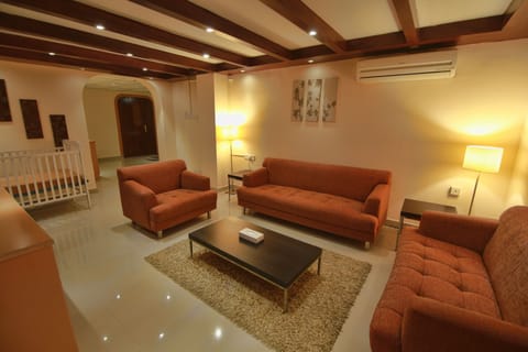 Suite | Living room | LCD TV, fireplace